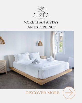 Bedroom with a low wooden platform bed, white linens, pendant lights, and a window; branding reads 'More than a stay, an experience'.
