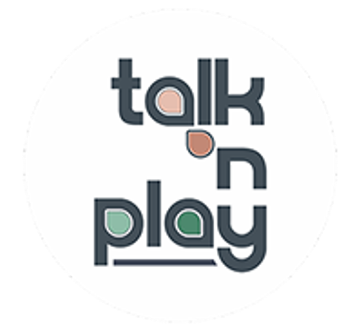 Round white logo for 'Talk n Play' with stylized dark blue lettering and pink/green accent shapes.
